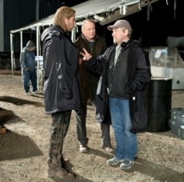 Left to right: Chris Hemsworth (as Thor), Stellan Skarsgård (as Selvig), and director Kenneth Branagh discuss a scene on the set of THOR, from Paramount Pictures and Marvel Entertainment.