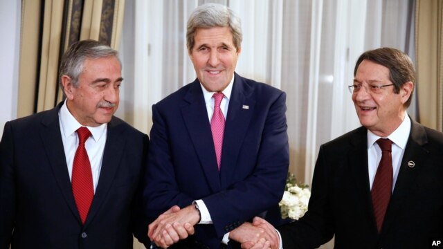 From left: Turkish Cypriot Leader Mustafa Akinci, U.S. Secretary of State John Kerry and Cyprus President Nicos Anastasiades shake hands before a dinner at the UNFICYP Residence, in Nicosia, Dec. 3, 2015.