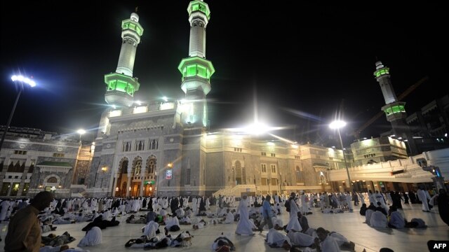 Muslim piligrims are seen ahead of morning prayers in Mecca's Grand Mosque, on October 13, 2013.