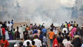 A photo taken on September 28, 2012 in Conkary, Guinea shows youth in the street during the funeral procession for two young opposition supporters killed by police during recent clashes. 