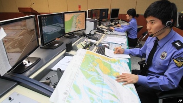 South Korean officials of the Incheon Maritime Police Agency monitor a situation room while on high alert in preparation for North Korea's planned launch of a Unha-3 rocket, in Incheon, South Korea, April 12, 2012.
