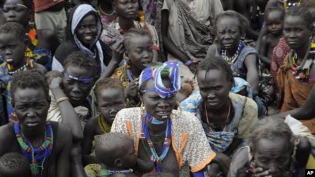Victims of ethnic violence in Jonglei, state, South Sudan, wait in line at the World Food Program distribution center in Pibor, South Sudan to receive emergency food rations, January12, 2012.
