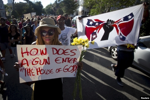 FILE - People take part in "Black Lives Matter" march around Emanuel African Methodist Episcopal Church in Charleston, June 20, 2015.