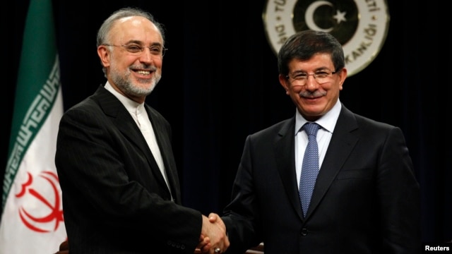 FILE - Turkey's Foreign Minister Ahmet Davutoglu and Iranian counterpart Ali Akbar Salehi, left, at news conference, Ankara, Jan. 19, 2012.
