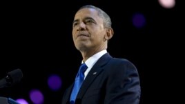 President Barack Obama pauses as he speaks at the election night party at McCormick Place in Chicago, early Wednesday, Nov. 7, 2012.
