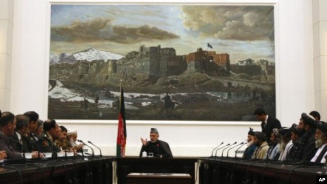 Afghanistan's President Hamid Karzai speaks during a meeting with the family members of civilians killed by U.S. soldier in Kandahar last week at the presidential palace in Kabul, March 16, 2012. 
