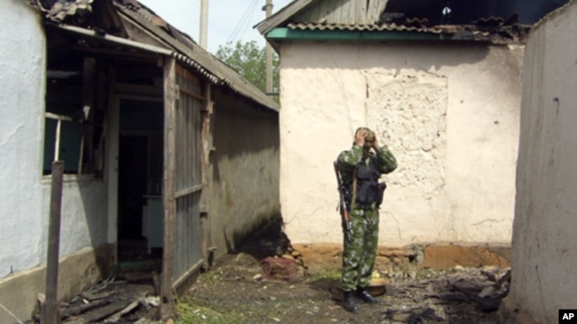 A Russian special forces trooper stands amidst the rubble following a major police operation in Khasavyurt, Dagestan, near the border with Chechnya (file photo)