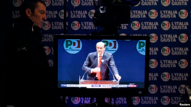 A television screen shows Democratic Party leader Pierluigi Bersani at a media center in Rome, February 26, 2013. 