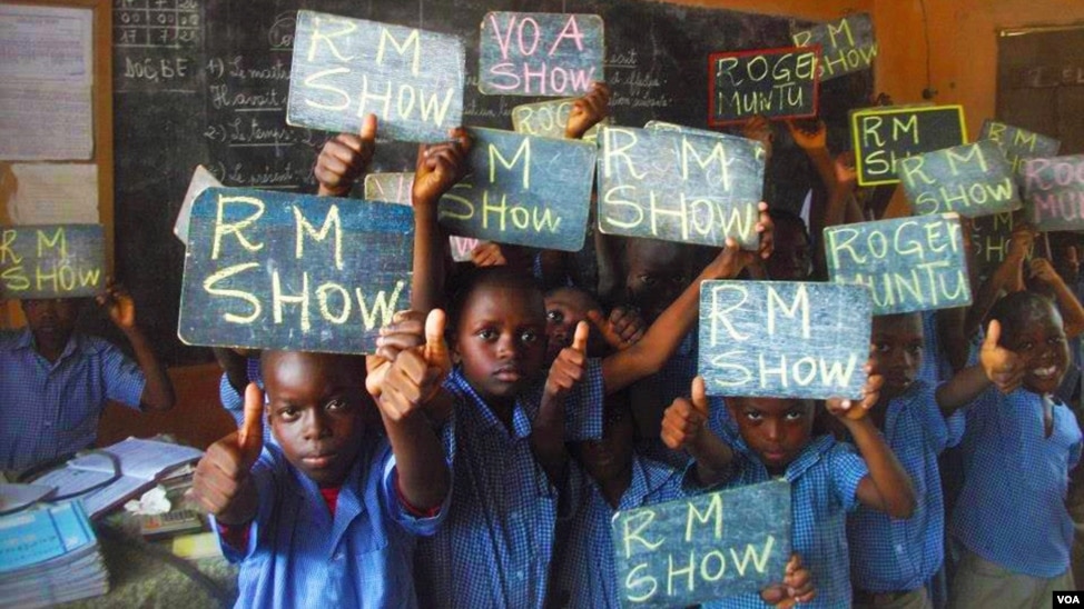 Adoring fans of Roger Muntu's "RM Show" take a break from school to pose for photos in Lome, Togo. The "RM Show," part of VOA's French to Africa Service, is a sociocultural music program that airs daily from 4 - 4:30 p.m.