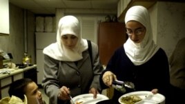 A Muslim family end their day of fasting with a meal at a mosque in Cedar Rapids, Iowa