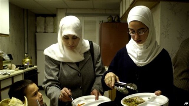 A Muslim family end their day of fasting with a meal at a mosque in Cedar Rapids, Iowa