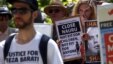 FILE - Protesters react as they hold placards and listen to speakers during a rally in support of refugees in central Sydney, Australia, Oct. 19, 2015. Australia said on April 3, 2016, it is no longer detaining asylum-seeking children on its mainland. 