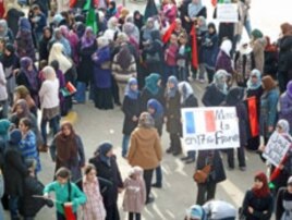 At a woman's rally in Benghazi, Libya, supporters show their appreciation that France has recognized the Transitional Council as the legitimate representative of the Libyan people, March 10, 2011