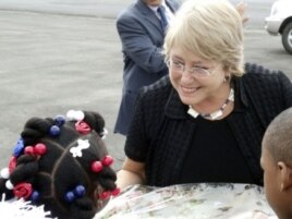 Michelle Bachelet is greeted by young children at Monrovia's Roberts International Airport on her first visit to Liberia in her new position.