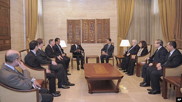 Syria's President Bashar al-Assad (center R) meets U.N.-Arab League envoy Kofi Annan (center L) in Damascus March 10, 2012.
