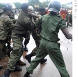Guinea's military leads away protesters during violent government crackdown at a Conakry soccer stadium. 28 Sep 2009
