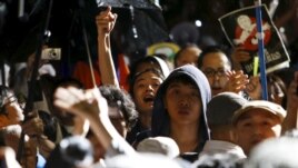 Protestors demonstrate against changes to Japan's security laws in front of Parliament in Tokyo on September 16, 2015.
