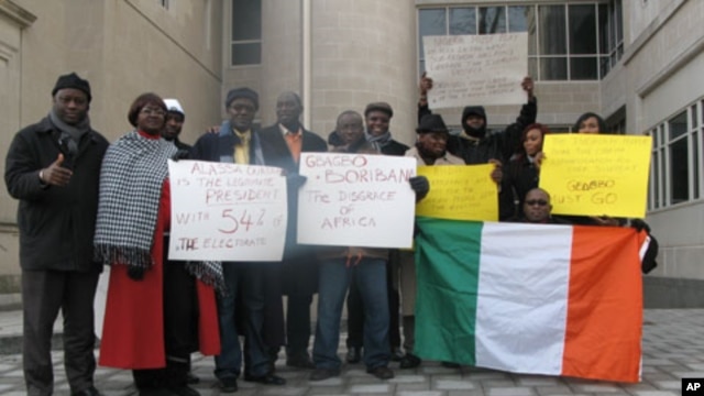 These pro-Ouattara protesters outside the Ivory Coast embassy in Washington support the current U.S. policy, but others are more reserved.