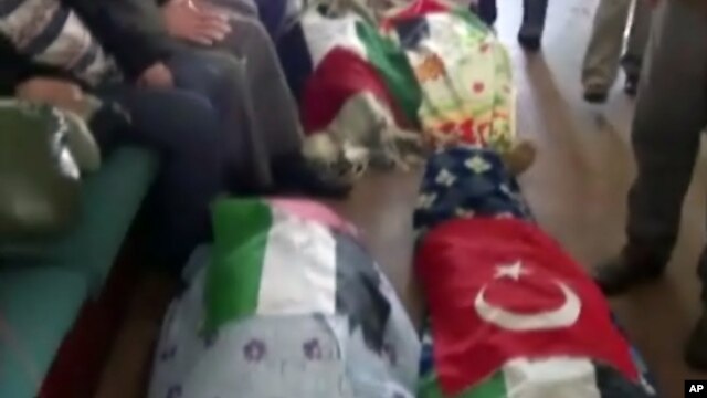 Image made from video provided by TVNET, June 4, 2010, shows bodies shrouded in sheets and flags on board the aid ship Mavi Marmara after a maritime showdown between Israeli commandos and activists on board the ship.