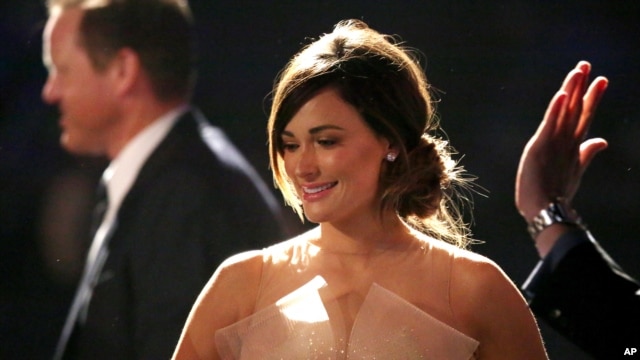 Kacey Musgraves, winner of the best country song award for "Merry Go 'Round", walks on stage at the pre-telecast of the 56th annual GRAMMY Awards on Jan. 26, 2014, in Los Angeles.