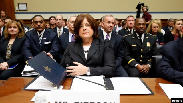 U.S. Secret Service Director Julia Pierson prepares to testify to the House Oversight and Government Reform Committee hearing, Sept. 30, 2014. Pierson resigned a day later. (REUTERS/Kevin Lamarque)