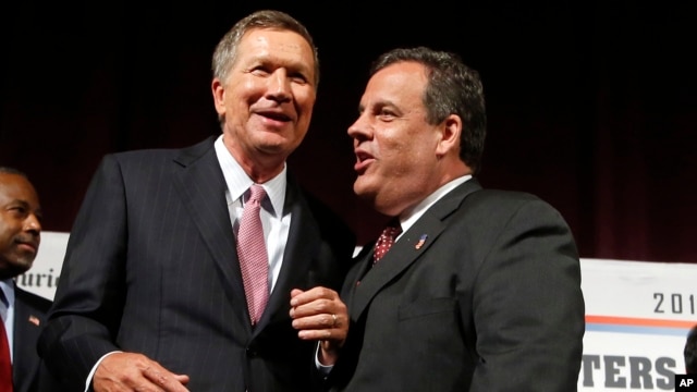 FILE - Republican presidential candidates, John Kasich and Chris Christie after an Aug. 3, 2015 forum in Manchester, N.H.