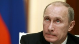 Russia's President Vladimir Putin looks on during a news conference at the Kremlin in Moscow, November 8, 2012.  
