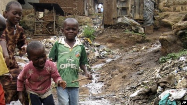 Children play near a punctured water pipe in Nairobi's Kibera slums (File Photo)