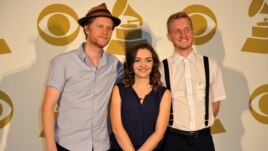 The Lumineers, (L-R) Wesley Schultz, Neyla Pekarek and Jeremiah Fraites pose for a photo backstage at the Grammy Nominations Concert Live! at Bridgestone Arena, Dec. 5, 2012, in Nashville, Tennessee.