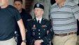Army Pfc. Bradley Manning, center, is escorted out of a courthouse in Fort Meade, Md.,  June 17, 2013.