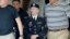 Army Pfc. Bradley Manning, center, is escorted out of a courthouse in Fort Meade, Md.,  June 17, 2013.