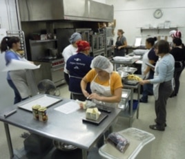 After going through its training program, Verred Joharie (center in yellow) is now employed at Sunflower Bakery and hopes to have a career in the baking industry.