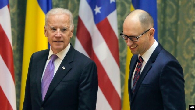 U.S. Vice President Joe Biden, left, talks with Ukrainian Prime Minister Arseniy Yatsenyuk during a meeting in Kiev, Ukraine, Nov. 21, 2014.