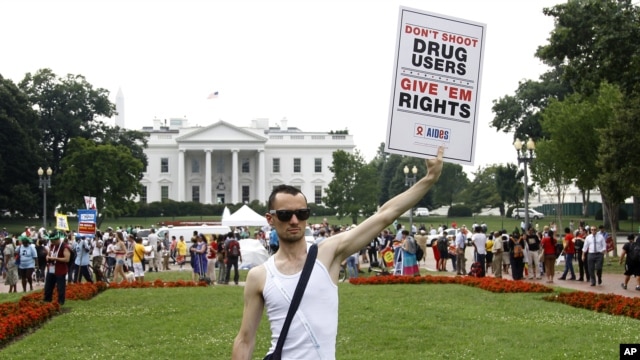 Vincent Leclercq of France demonstrates in front of the White House in Washington as the AIDS conference continues in Washington, July 24, 2012.