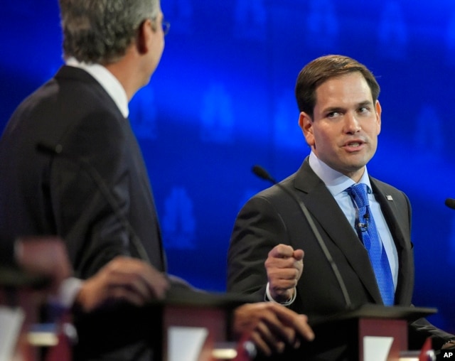 Marco Rubio, right, and Jeb Bush, argue a point during the CNBC Republican presidential debate at the University of Colorado, Wednesday, Oct. 28, 2015.