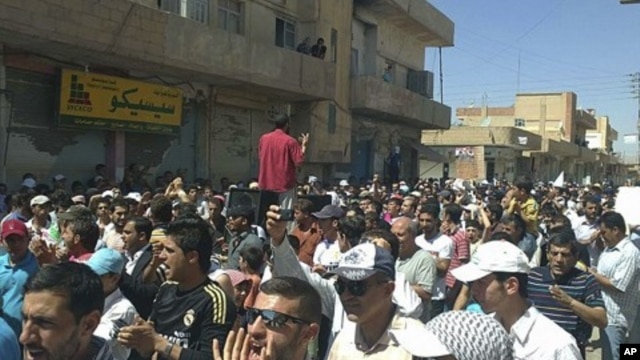 Syrians protest against President Bashar al-Assad after Friday prayers in the city of Amude, August 26, 2011.