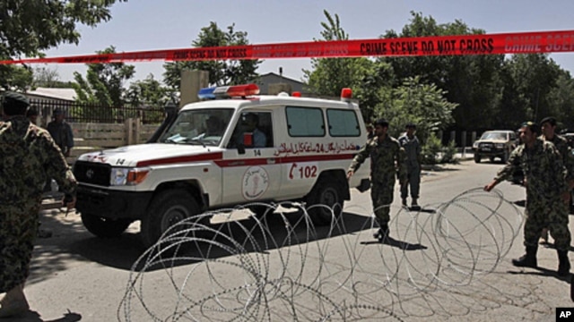 An ambulance leaves Kabul's main military hospital in Kabul, Afghanistan, Saturday, May 21, 2011