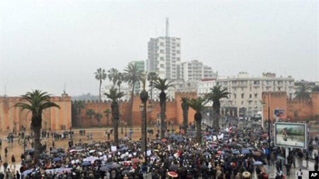Moroccans gather during a protest demanding broad political reforms in Morocco in Rabat, February 20, 2011