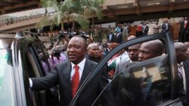 Kenya's Deputy Prime Minister Uhuru Kenyatta leaves after he was cleared by the Independent Electoral and Boundaries Commission to run for presidency in the March 4 presidential elections, in capital Nairobi, Kenya, Jan. 30, 2013.