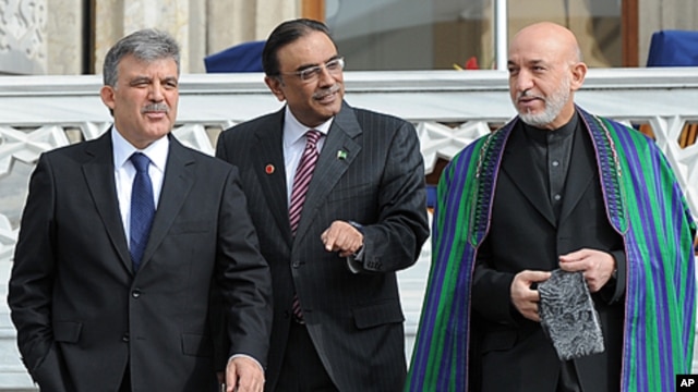Turkish President Abdullah Gul, left, his Afghan counterpart Hamid Karzai, right, and President Asif Ali Zardari of Palistan walk after a meeting in Istanbul, Turkey. Turkey is hosting a conference this week on creating a regional strategy for improving s