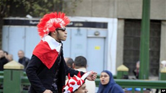 Egyptians celebrate on Tahrir Square in Cairo, February 12, 2011