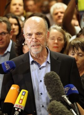 Olympic athlete Oscar Pistorius' uncle, Arnold Pistorius, speaks to journalists at the end of the bail hearing at the magistrate court in Pretoria, South Africa, Feb. 22, 2013.