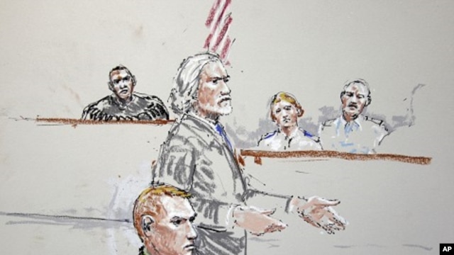 U.S. Army Staff Sgt. Calvin Gibbs, seated at lower left, is shown in this courtroom sketch as his attorney Phil Stackhouse stands at center, and military Judge Lt. Col. Kwasi Hawks listens, at top left, October 31, 2011, at Joint Base Lewis-McChord in Was