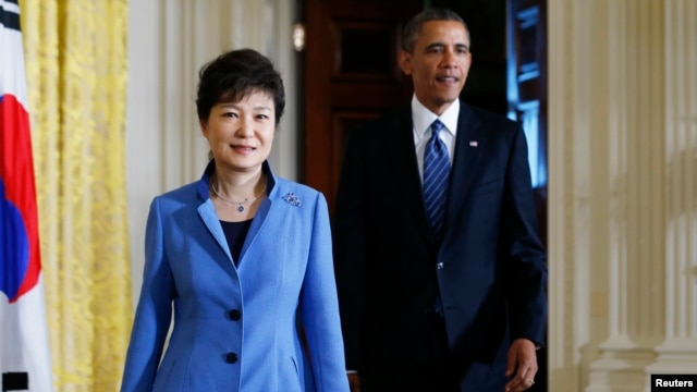 U.S. President Barack Obama and South Korea's President Park Geun-hye arrive for a joint news conference in the East Room of the White House in Washington, May 7, 2013.  