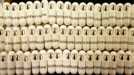These capsules of thalidomide, seen at the Celgene Corp. in Warren, N.J., April 7, 1998, carry a symbol of a pregnant woman to warn women who are pregnant or may be soon against use of the drug that had caused thousands of infant deformities. 