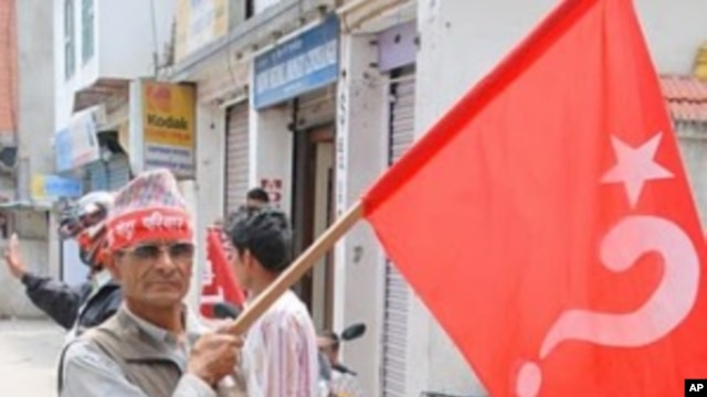 Maoist supporter en route for a mass rally in central Kathmandu, 1 May 2010