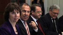 FILE - In this Monday, July 11, 2011 file photo from left : European Union High Representative Catherine Ashton, Russian Foreign Minister Sergey Lavrov, Russian Deputy Foreign Minister Mikhail Bogdanov and Russian Ambassador Sergei Yakovlev, attend a dinner at the State Department in Washington. 