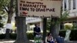  Supporters of the employees of state broadcaster ERT sit outside its headquarters in Athens, June 17, 2013.