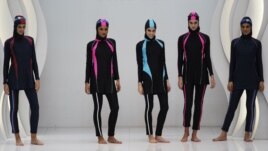 Models present swimwear for Muslim women by Malaysian designer Aktif Bestari at the Islamic Fashion Festival, November 3, 2010.