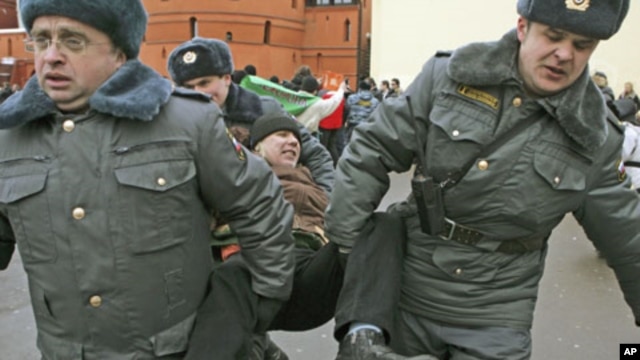 Russian police detain a participant during an opposition rally in Moscow, March 17, 2012.